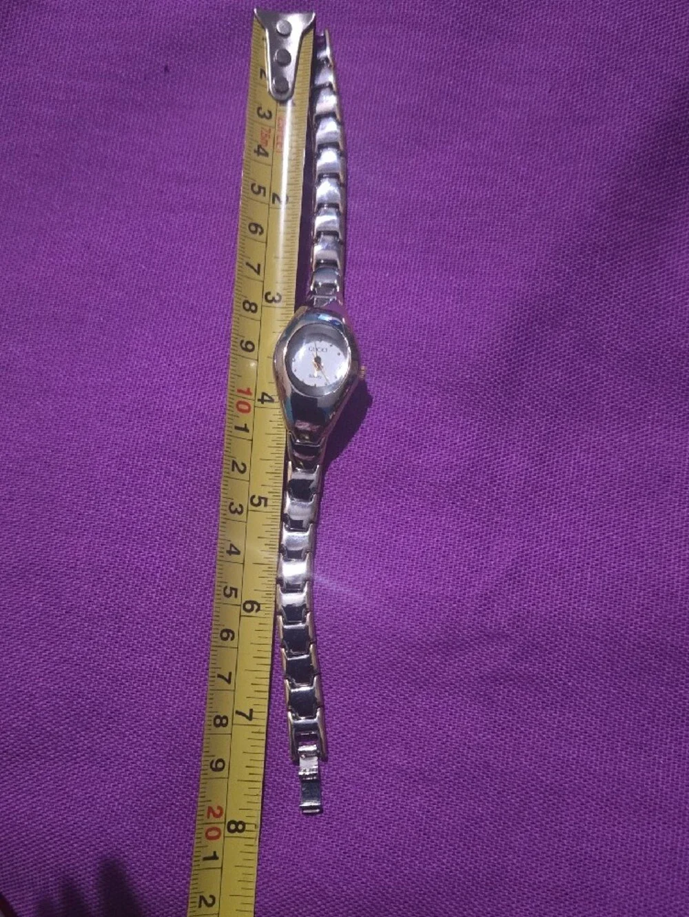 Gucci Silver-Tone Bracelet Watch with White Dial and Gold Accents